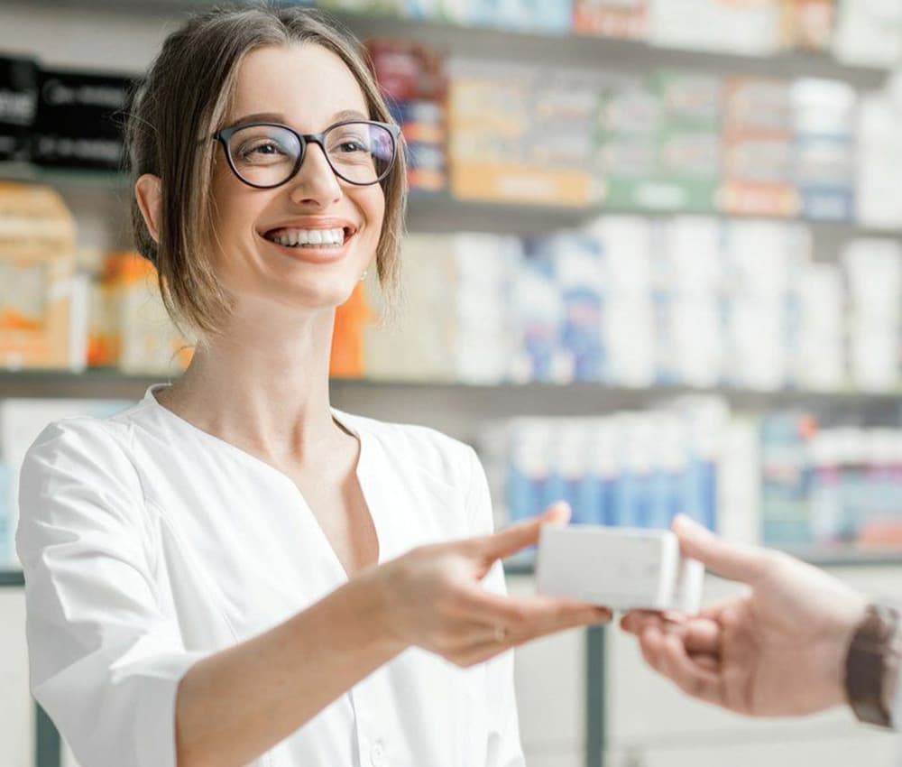 pharmacist greeting a patient inside Southside Family Pharmacy